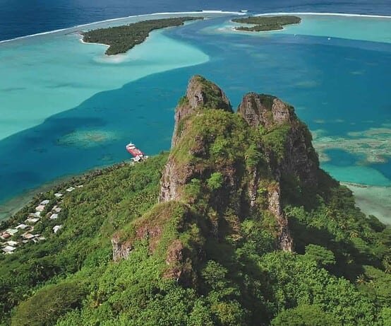 Breathtaking,Aerial,Perspective,Teurafaatiu,Mountain,Peak,Rising,Over,Vibrant,Turquoise