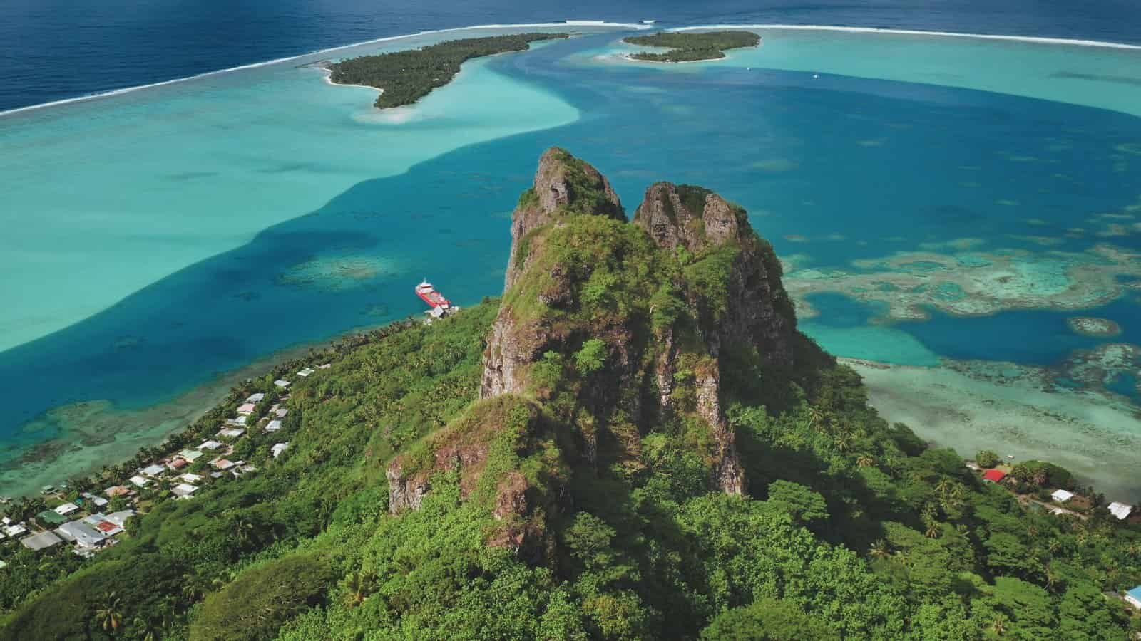 Breathtaking,Aerial,Perspective,Teurafaatiu,Mountain,Peak,Rising,Over,Vibrant,Turquoise